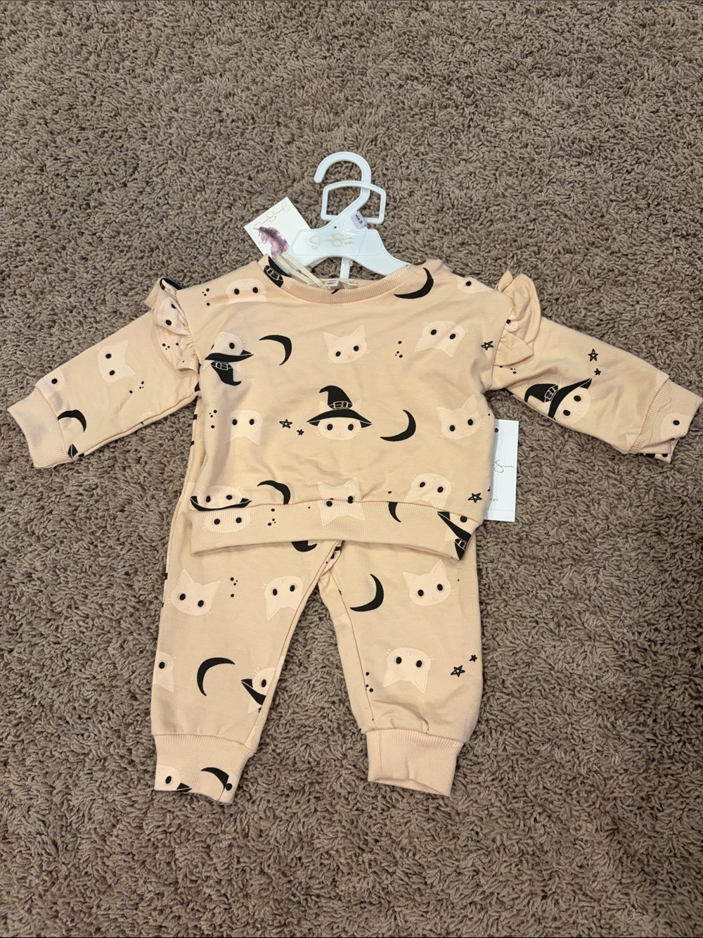 Jessica Simpson has pale pink Halloween Kids Pajama Set with Cat & Moon Print